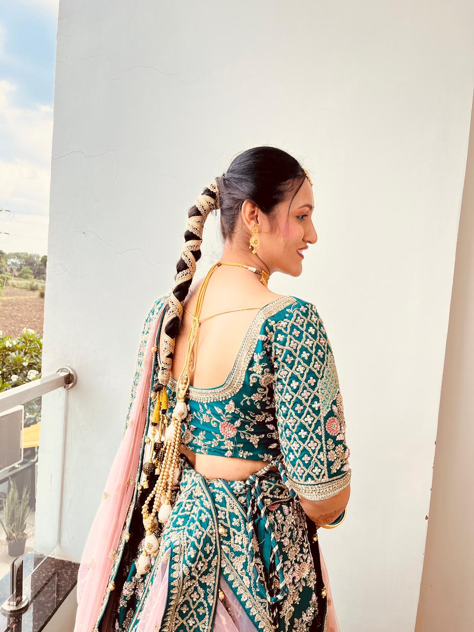 The perfect bridal hairstyle to match a stunning lehenga look by Glamvibe.