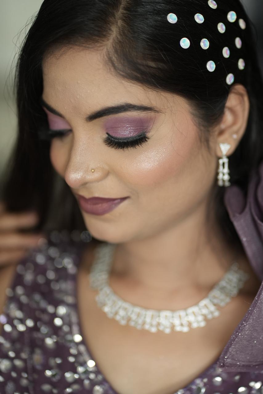 Trending glitter eyes paired with chic hair accessories by Glamvibe.